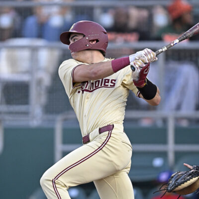 FSU infielder Alex Lodise hits a single in the first inning as the Miami Hurricanes faced the Florida State Seminoles at Mark Light Field at Alex Rodriguez Park.