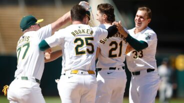 OAKLAND, CALIFORNIA - MAY 23: Tyler Soderstrom #21 of the Oakland Athletics celebrates with teammates after drawing a walk with bases loaded to win the game against the Colorado Rockies at Oakland Coliseum on May 23, 2024 in Oakland, California. (Photo by Lachlan Cunningham/Getty Images)