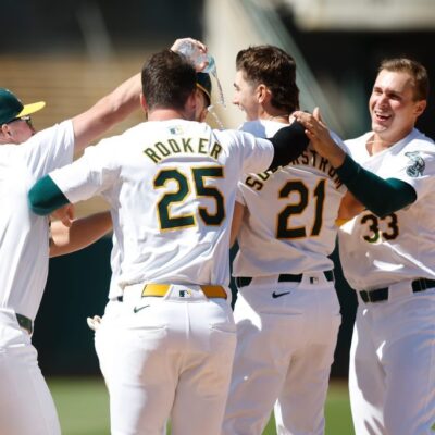 OAKLAND, CALIFORNIA - MAY 23: Tyler Soderstrom #21 of the Oakland Athletics celebrates with teammates after drawing a walk with bases loaded to win the game against the Colorado Rockies at Oakland Coliseum on May 23, 2024 in Oakland, California. (Photo by Lachlan Cunningham/Getty Images)