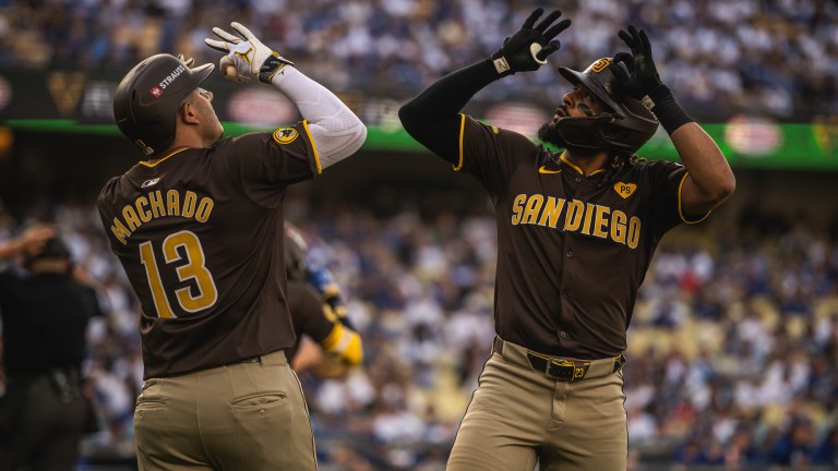 LOS ANGELES, CALIFORNIA - OCTOBER 6: Fernando Tatis Jr. #23 and Manny Machado #13 of the San Diego Padres celebrate after Tatis home run in the first inning of game two of the National League Divisional Series against the Los Angeles Dodgers at Dodger Stadium on October 6, 2024, in Los Angeles, California. (Photo by Matt Thomas/San Diego Padres/Getty Images)