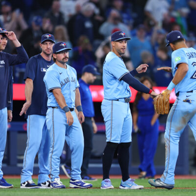 TORONTO, ON - APRIL 02: Chris Bassitt #40, Max Scherzer #31, Davis Schneider #36, George Springer #4 and Anthony Santander #25 of the Toronto Blue Jays celebrate the win following a game against the Washington Nationals at Rogers Centre on April 02, 2025 in Toronto, Ontario, Canada. (Photo by Vaughn Ridley/Getty Images)