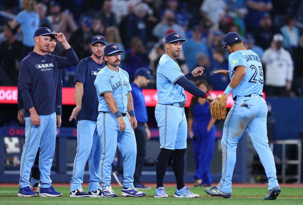 TORONTO, ON - APRIL 02: Chris Bassitt #40, Max Scherzer #31, Davis Schneider #36, George Springer #4 and Anthony Santander #25 of the Toronto Blue Jays celebrate the win following a game against the Washington Nationals at Rogers Centre on April 02, 2025 in Toronto, Ontario, Canada. (Photo by Vaughn Ridley/Getty Images)