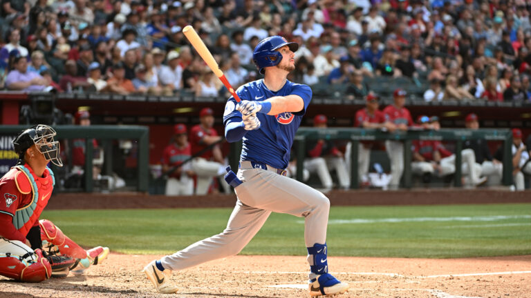 Kyle Tucker #30 of the Chicago Cubs hits a three run home run against the Arizona Diamondbacks during the eighth inning at Chase Field.