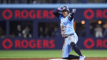 TORONTO, ON - MARCH 31: George Springer #4 of Toronto Blue Jays celebrates his double against the Washington Nationals during the sixth inning in their MLB game at the Rogers Centre on March 31, 2025 in Toronto, Ontario, Canada. (Photo by Mark Blinch/Getty Images)