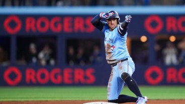 TORONTO, ON - MARCH 31: George Springer #4 of Toronto Blue Jays celebrates his double against the Washington Nationals during the sixth inning in their MLB game at the Rogers Centre on March 31, 2025 in Toronto, Ontario, Canada. (Photo by Mark Blinch/Getty Images)