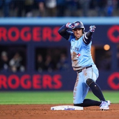 TORONTO, ON - MARCH 31: George Springer #4 of Toronto Blue Jays celebrates his double against the Washington Nationals during the sixth inning in their MLB game at the Rogers Centre on March 31, 2025 in Toronto, Ontario, Canada. (Photo by Mark Blinch/Getty Images)
