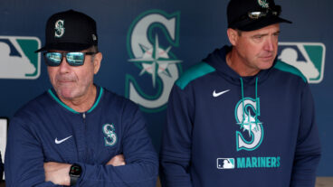 SEATTLE, WASHINGTON - APRIL 09: Senior Director, Hitting Strategy Edgar Martinez #11 and manager Dan Wilson #6 of the Seattle Mariners look on before the game against the Houston Astros at T-Mobile Park on April 09, 2025 in Seattle, Washington. (Photo by Steph Chambers/Getty Images)