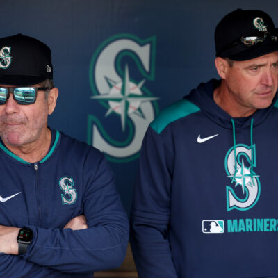 SEATTLE, WASHINGTON - APRIL 09: Senior Director, Hitting Strategy Edgar Martinez #11 and manager Dan Wilson #6 of the Seattle Mariners look on before the game against the Houston Astros at T-Mobile Park on April 09, 2025 in Seattle, Washington. (Photo by Steph Chambers/Getty Images)