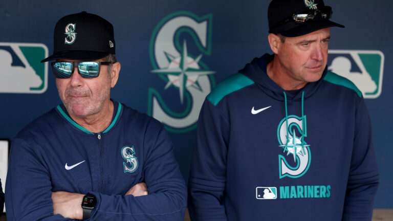 SEATTLE, WASHINGTON - APRIL 09: Senior Director, Hitting Strategy Edgar Martinez #11 and manager Dan Wilson #6 of the Seattle Mariners look on before the game against the Houston Astros at T-Mobile Park on April 09, 2025 in Seattle, Washington. (Photo by Steph Chambers/Getty Images)