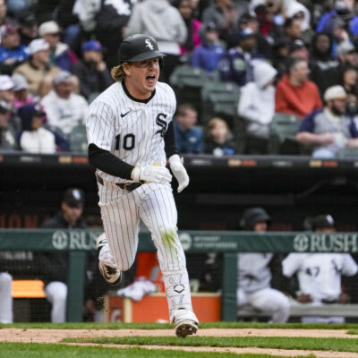 Chase Meidroth #10 of the Chicago White Sox runs to first base during the eighth inning of the game against the Boston Red Sox at Rate Field