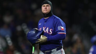 CHICAGO, ILLINOIS - APRIL 8: Joc Pederson #4 of the Texas Rangers looks on during a game against the Chicago Cubs at Wrigley Field on April 8, 2025 in Chicago, Illinois. (Photo by Geoff Stellfox/Getty Images)