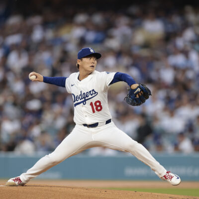 LOS ANGELES, CALIFORNIA - APRIL 11: Yoshinobu Yamamoto #18 of the Los Angeles Dodgers throws against the Chicago Cubs in the first inning at Dodger Stadium on April 11, 2025 in Los Angeles, California. (Photo by Ronald Martinez/Getty Images)