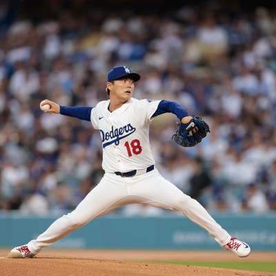 LOS ANGELES, CALIFORNIA - APRIL 11: Yoshinobu Yamamoto #18 of the Los Angeles Dodgers throws against the Chicago Cubs in the first inning at Dodger Stadium on April 11, 2025 in Los Angeles, California. (Photo by Ronald Martinez/Getty Images)