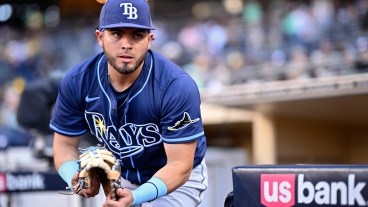 SAN DIEGO, CALIFORNIA - APRIL 25: Jonathan Aranda #62 of the Tampa Bay Rays runs onto the field before the game against the San Diego Padres at Petco Park on April 25, 2025 in San Diego, California. (Photo by Orlando Ramirez/Getty Images)
