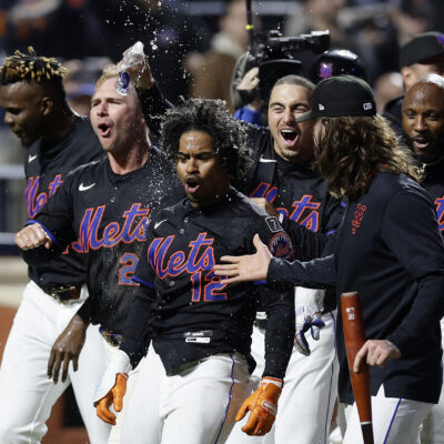 NEW YORK, NEW YORK - APRIL 18: Francisco Lindor #12 of the New York Mets celebrates his ninth inning game winning home run against the St. Louis Cardinals with his teammates at Citi Field on April 18, 2025 in New York City. (Photo by Jim McIsaac/Getty Images)