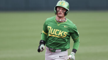 Outfielder Mason Neville of the Oregon Ducks runs the bases after hitting a home run during the fourth inning against the Oregon State Beavers at Goss Stadium.