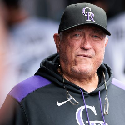 Hitting coach Clint Hurdle of the Colorado Rockies looks on in the dugout during the fifth inning against the Washington Nationals at Coors Field.
