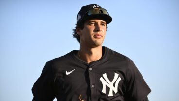 Spencer Jones of the New York Yankees jogs off the field following the second inning of a Spring Breakout game against the Baltimore Orioles at Ed Smith Stadium.