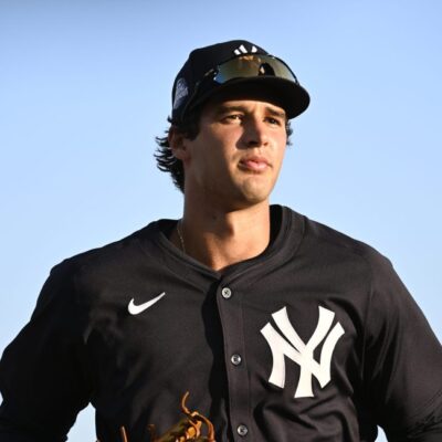 Spencer Jones of the New York Yankees jogs off the field following the second inning of a Spring Breakout game against the Baltimore Orioles at Ed Smith Stadium.