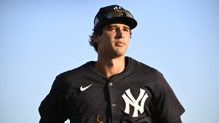 Spencer Jones of the New York Yankees jogs off the field following the second inning of a Spring Breakout game against the Baltimore Orioles at Ed Smith Stadium.
