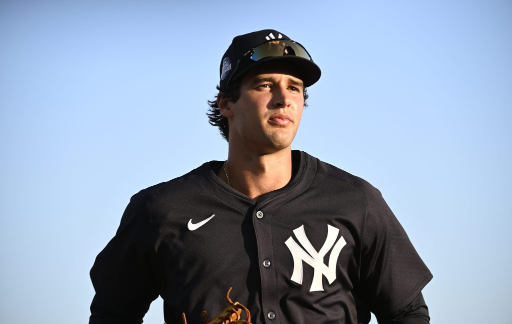 Spencer Jones of the New York Yankees jogs off the field following the second inning of a Spring Breakout game against the Baltimore Orioles at Ed Smith Stadium.