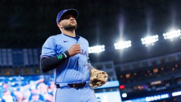 TORONTO, CANADA - APRIL 1: Bo Bichette #11 of the Toronto Blue Jays takes the field ahead of their MLB game against the Washington Nationals at Rogers Centre on April 1, 2025 in Toronto, Canada. (Photo by Cole Burston/Getty Images)