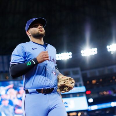 TORONTO, CANADA - APRIL 1: Bo Bichette #11 of the Toronto Blue Jays takes the field ahead of their MLB game against the Washington Nationals at Rogers Centre on April 1, 2025 in Toronto, Canada. (Photo by Cole Burston/Getty Images)