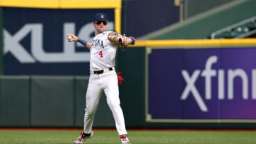 Brendan Summerhill of the Arizona Wildcats throws the warm up tosses in the first inning against the Tennessee Volunteers in the Astros Foundation College Classic at Daikin Park.