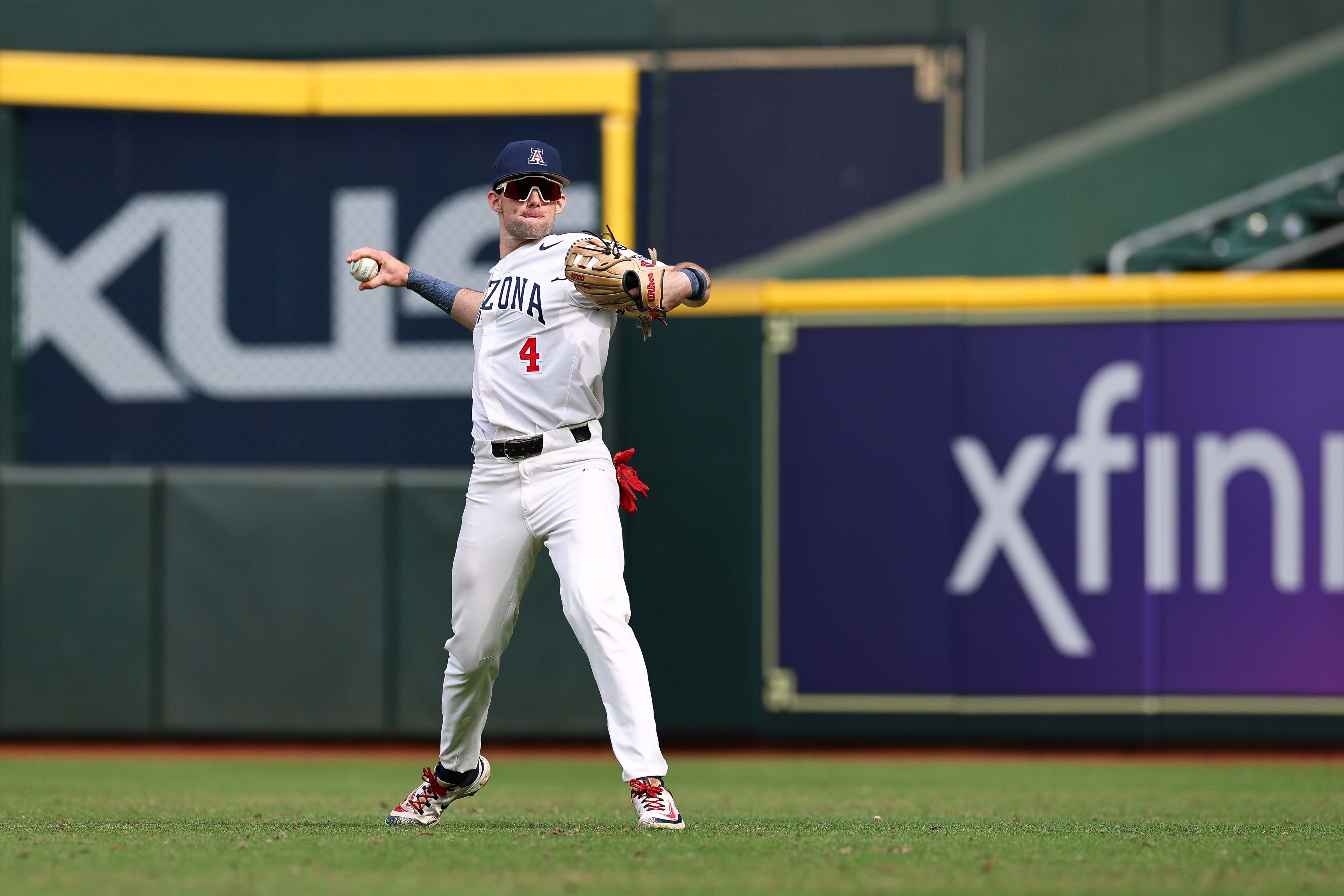 Brendan Summerhill of the Arizona Wildcats throws the warm up tosses in the first inning against the Tennessee Volunteers in the Astros Foundation College Classic at Daikin Park.