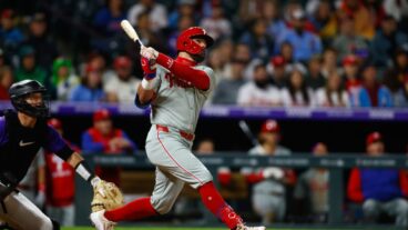 DENVER, CO - MAY 19: Kyle Schwarber #12 of the Philadelphia Phillies follows through on a solo home run in the ninth inning against the Colorado Rockies at Coors Field on May 19, 2025 in Denver, Colorado. The home run is Schwarber's 300th of his career. (Photo by Justin Edmonds/Getty Images)