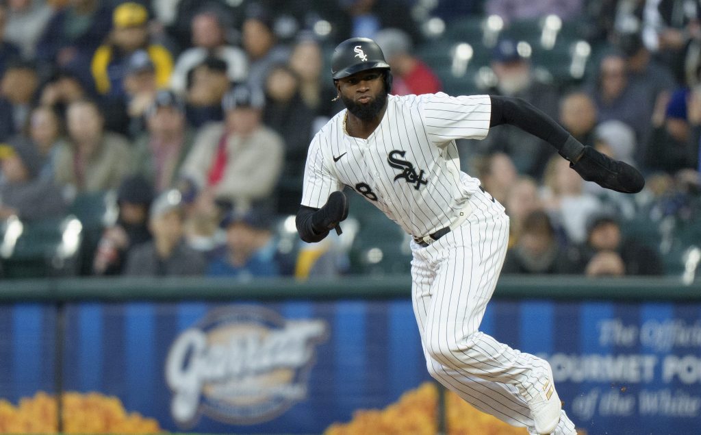 Luis Robert Jr of the Chicago White Sox steals second base in a game against the Milwaukee Brewers at Rate Field.