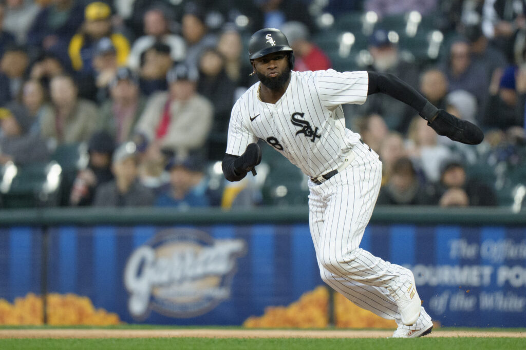 Luis Robert Jr of the Chicago White Sox steals second base in a game against the Milwaukee Brewers at Rate Field.