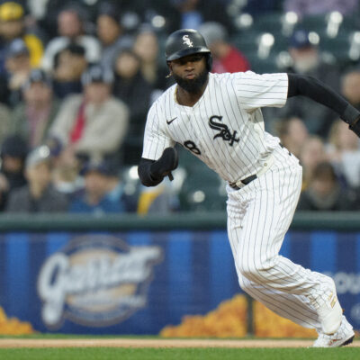 Luis Robert Jr of the Chicago White Sox steals second base in a game against the Milwaukee Brewers at Rate Field.