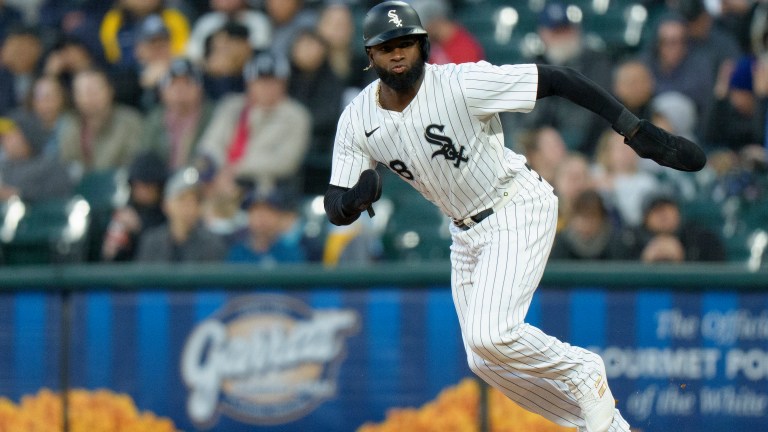 Luis Robert Jr of the Chicago White Sox steals second base in a game against the Milwaukee Brewers at Rate Field.