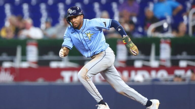 MIAMI, FLORIDA - MAY 17: Chandler Simpson #14 of the Tampa Bay Rays runs to second base against the Miami Marlins in the ninth inning of the game at loanDepot park on May 17, 2025 in Miami, Florida. (Photo by Megan Briggs/Getty Images)