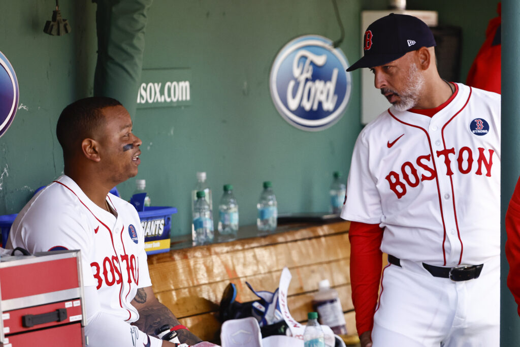 BOSTON, MA - APRIL 21: Rafael Devers #11 of the Boston Red Sox talks with manager Alex Cora #13 during their game against the Chicago White Sox at Fenway Park on April 21, 2025 in Boston, Massachusetts. (Photo By Winslow Townson/Getty Images)