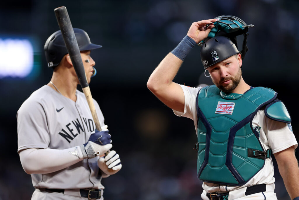 SEATTLE, WASHINGTON - MAY 13: Cal Raleigh #29 of the Seattle Mariners looks on while standing next to Aaron Judge #99 of the New York Yankees at T-Mobile Park on May 13, 2025 in Seattle, Washington. (Photo by Steph Chambers/Getty Images)