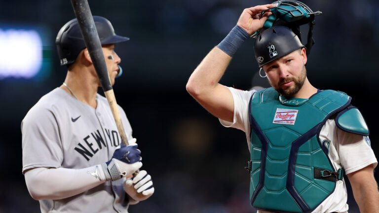 SEATTLE, WASHINGTON - MAY 13: Cal Raleigh #29 of the Seattle Mariners looks on while standing next to Aaron Judge #99 of the New York Yankees at T-Mobile Park on May 13, 2025 in Seattle, Washington. (Photo by Steph Chambers/Getty Images)