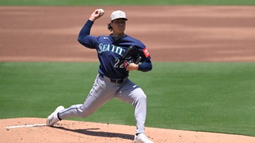 SAN DIEGO, CALIFORNIA - MAY 18: Bryan Woo #22 of the Seattle Mariners pitches against the San Diego Padres during the first inning at Petco Park on May 18, 2025 in San Diego, California. (Photo by Orlando Ramirez/Getty Images)
