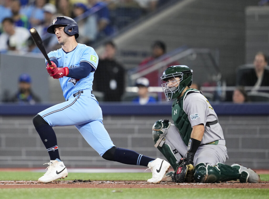 TORONTO, ON - MAY 29: Ernie Clement #22 of Toronto Blue Jays hits a two RBI double against the Athletics during the second inning in their MLB game at the Rogers Centre on May 29, 2025 in Toronto, Ontario, Canada. (Photo by Mark Blinch/Getty Images)