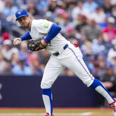 TORONTO, ON - JUNE 19: Ernie Clement #22 of Toronto Blue Jays fields a ball against the Arizona Diamondbacks during the fifth inning in their MLB game at the Rogers Centre on June 19, 2025 in Toronto, Ontario, Canada. (Photo by Mark Blinch/Getty Images)