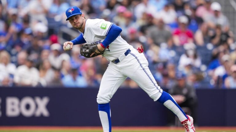 TORONTO, ON - JUNE 19: Ernie Clement #22 of Toronto Blue Jays fields a ball against the Arizona Diamondbacks during the fifth inning in their MLB game at the Rogers Centre on June 19, 2025 in Toronto, Ontario, Canada. (Photo by Mark Blinch/Getty Images)