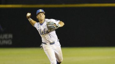 UCLA infielder Roch Cholowsky fields the ball at the NCAA baseball regional tournament game between UCLA and UC Irvine at Jackie Robinson Stadium.