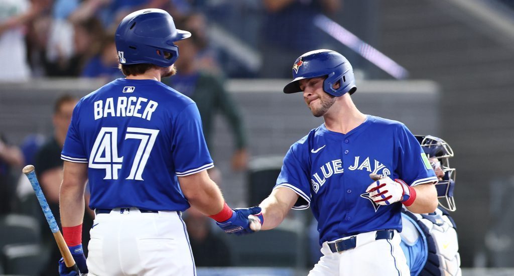TORONTO, ON - MAY 13: Ernie Clement #22 of the Toronto Blue Jays celebrates with Addison Barger #47 after hitting a solo home run in the seventh inning during a game against the Tampa Bay Rays at Rogers Centre on May 13, 2025 in Toronto, Ontario, Canada. (Photo by Vaughn Ridley/Getty Images)