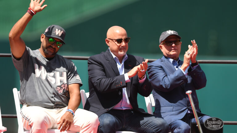 WASHINGTON, DC - JUNE 18: (L-R) Manger Dave Martinez #4, General Manager Mike Rizzo, and Principle Owner Mark Lerner of the Washington Nationals cheer during Ryan Zimmerman retirement ceremony before a baseball game against the Philadelphia Phillies at Nationals Park in Washington, DC. (Photo by Mitchell Layton/Getty Images)