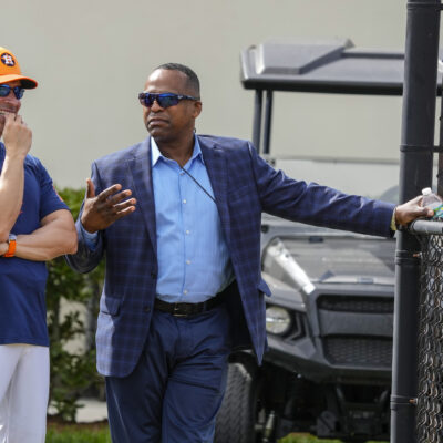 WEST PALM BEACH, FLORIDA - FEBRUARY 15: Houston Astros manager Joe Espada (19) and GM Dana Brown chat as they watched pitchers throw off the 10-pack during workouts for Houston Astros pitchers and catchers at CACTI Park of the Palm Beaches on Thursday, Feb. 15, 2024, in West Palm Beach, Florida. (Karen Warren/Houston Chronicle via Getty Images)