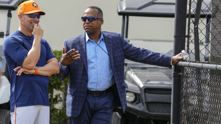 WEST PALM BEACH, FLORIDA - FEBRUARY 15: Houston Astros manager Joe Espada (19) and GM Dana Brown chat as they watched pitchers throw off the 10-pack during workouts for Houston Astros pitchers and catchers at CACTI Park of the Palm Beaches on Thursday, Feb. 15, 2024, in West Palm Beach, Florida. (Karen Warren/Houston Chronicle via Getty Images)