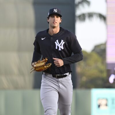 SARASOTA, FLORIDA - MARCH 15, 2025: Spencer Jones #70 of the New York Yankees jogs to the dugout during the third inning of a Spring Breakout game against the Baltimore Orioles at Ed Smith Stadium on March 15, 2025 in Sarasota, Florida. (Photo by Diamond Images via Getty Images)