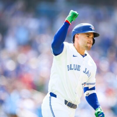 TORONTO, CANADA - JULY 5: George Springer #4 of the Toronto Blue Jays reacts as he rounds the bases on a two-run home run to score in Nathan Lukes #38 in the third inning of their MLB game against the Los Angeles Angels at Rogers Centre on July 5, 2025 in Toronto, Ontario, Canada. (Photo by Cole Burston/Getty Images)