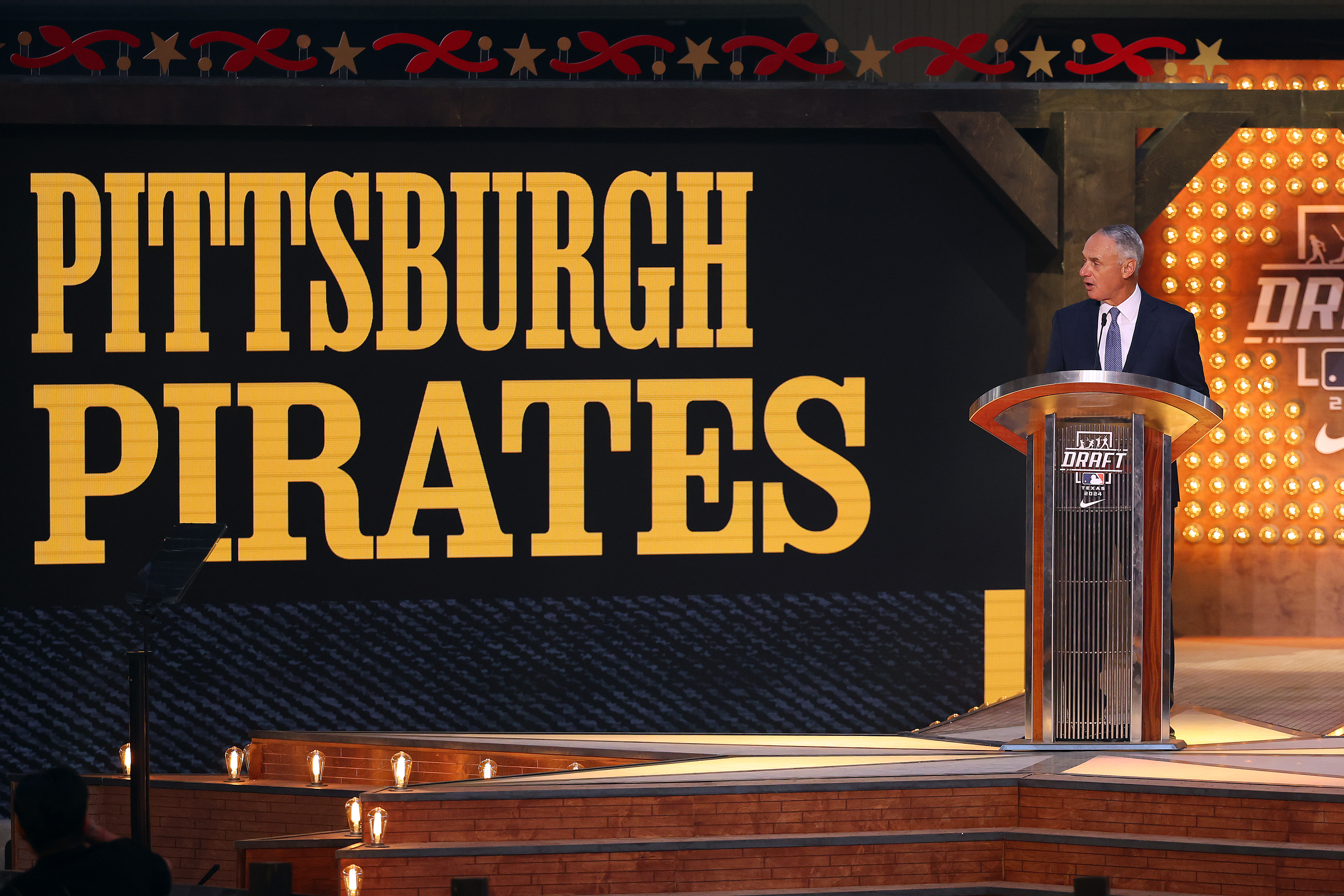 FORT WORTH, TEXAS - JULY 14: Major League Baseball commissioner Robert D. Manfred Jr. announces the pick for the Pittsburgh Pirates at the 2024 MLB Draft at Cowtown Coliseum on July 14, 2024 in Fort Worth, Texas. (Photo by Richard Rodriguez/Getty Images)